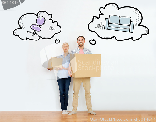 Image of couple with cardboard boxes moving to new home