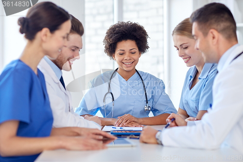 Image of group of happy doctors meeting at hospital office