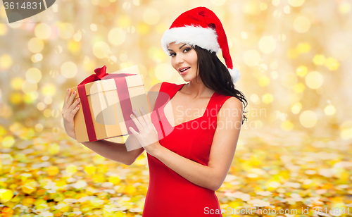 Image of beautiful sexy woman in santa hat with gift box