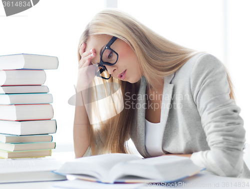 Image of student with books and notes