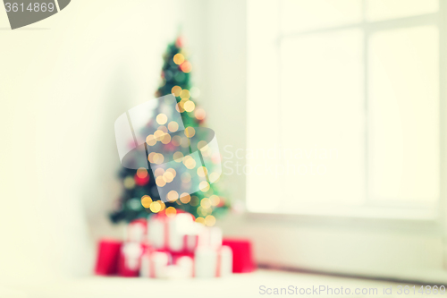 Image of room with christmas tree and presents background