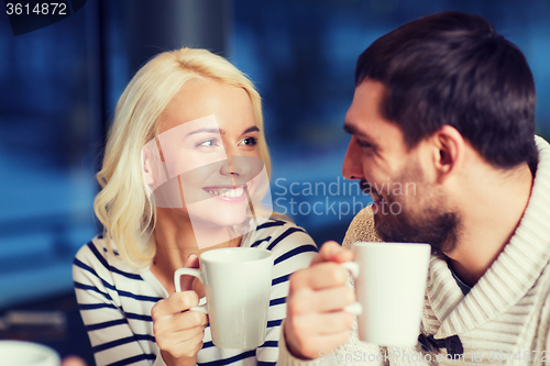 Image of happy couple meeting and drinking tea or coffee