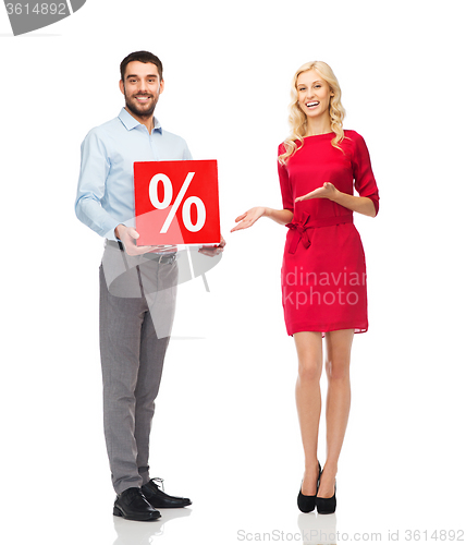 Image of happy couple with red sale sign