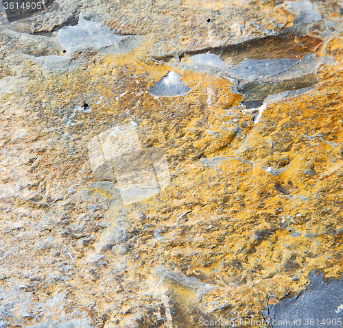 Image of rocks stone and red orange gneiss in the wall of morocco