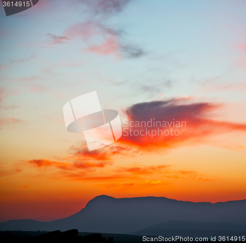 Image of mountain in morocco africa lans and red sunrise