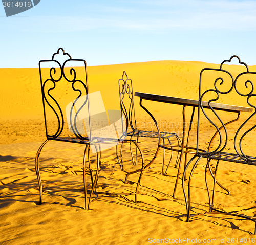 Image of table and seat in desert  sahara morocco   africa yellow sand