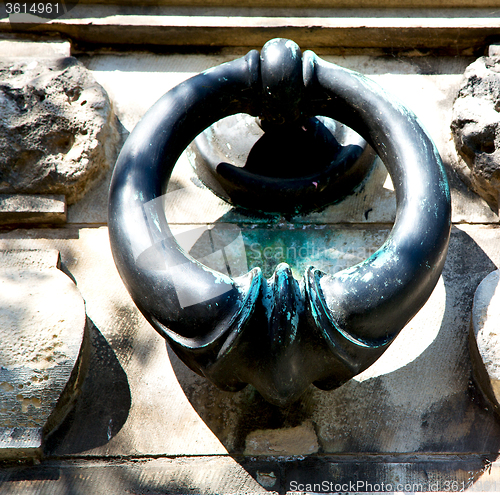Image of blue   handle in london antique concrete  rusty  brass nail and 