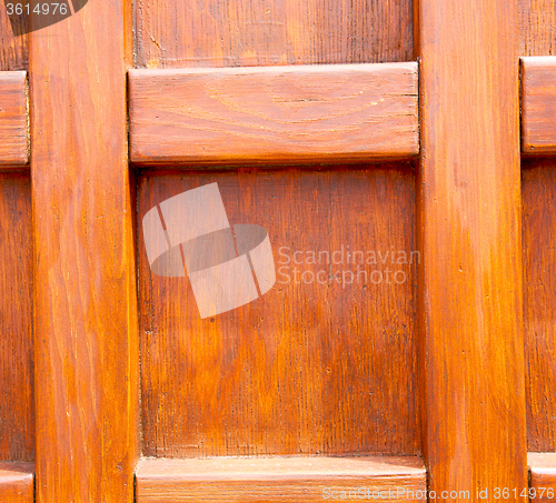 Image of home texture of a brown antique wooden old door in italy   europ