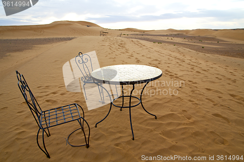 Image of table and seat in desert  sahara morocco    africa yellow sand