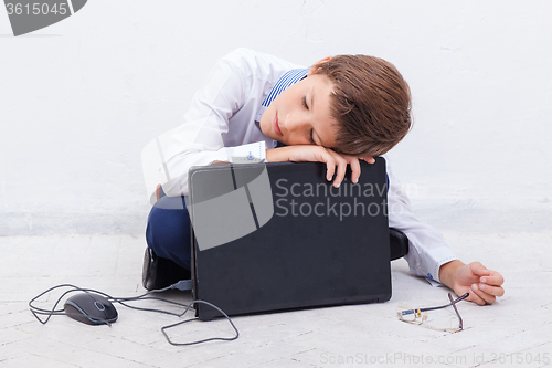 Image of Boy using his laptop computer