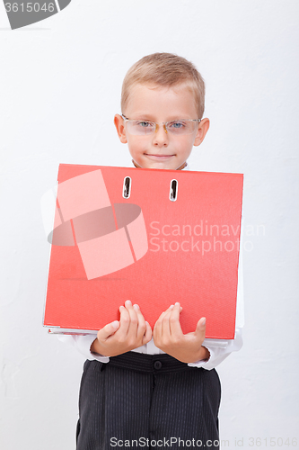 Image of The boy with folders 