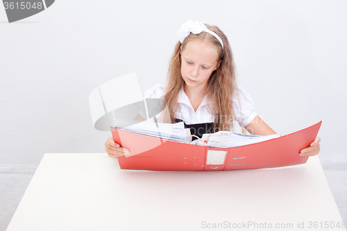 Image of Schoolgirl with folders 