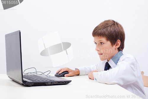 Image of Boy using his laptop computer