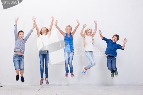 Image of Group of happy young people jumping  on white background