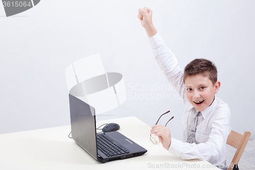 Image of Boy using his laptop computer