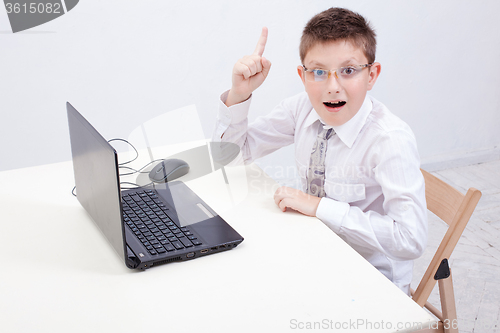 Image of Boy using his laptop computer