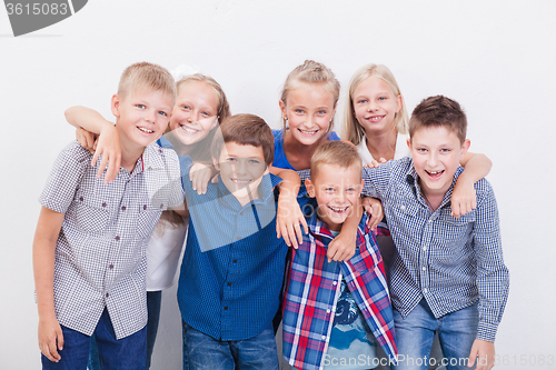 Image of The smiling teenagers on white 