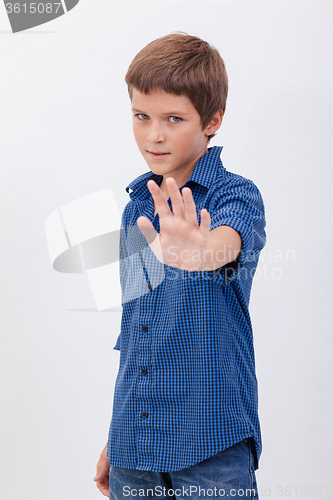 Image of Handsome boy doing stop sign