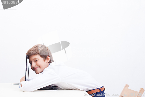 Image of Boy using his laptop computer