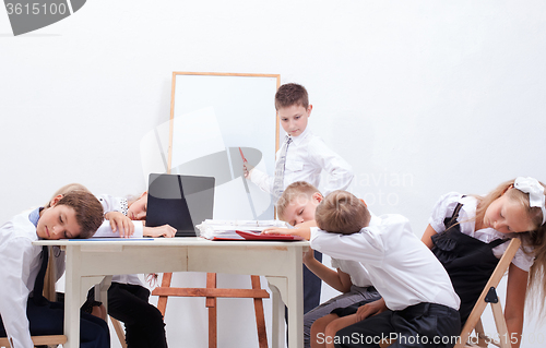 Image of The group of teenagers sitting in a business meeting