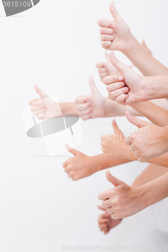 Image of hands of teenagers showing okay sign on white 