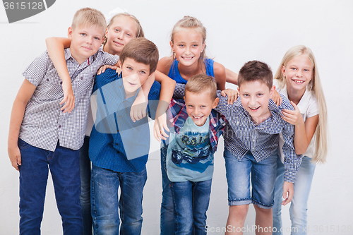 Image of The smiling teenagers on white 