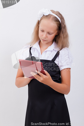 Image of Portrait of teen girl with calculator on white background