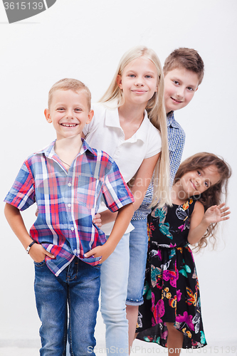 Image of The smiling teenagers on white 