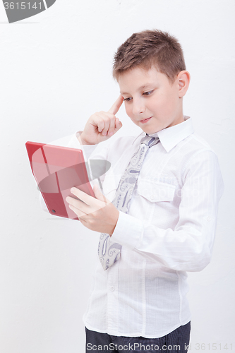 Image of Portrait of teen boy with calculator on white background