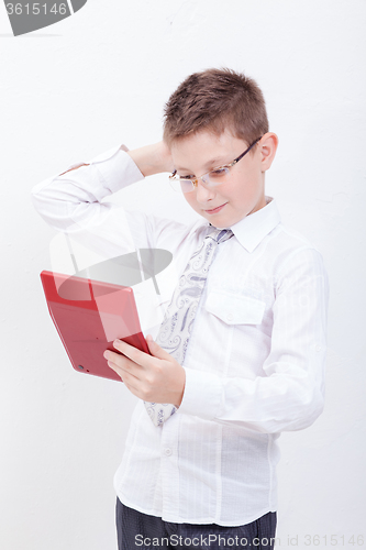 Image of Portrait of teen boy with calculator on white background