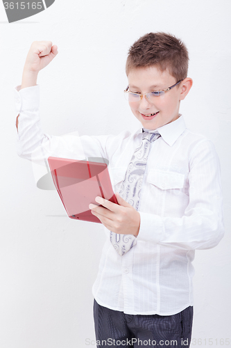 Image of Portrait of teen boy with calculator on white background