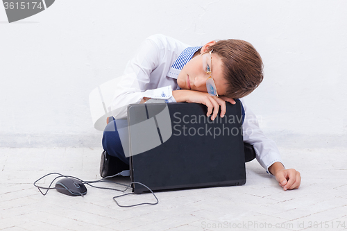 Image of Boy using his laptop computer