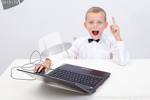 Image of Boy using his laptop computer
