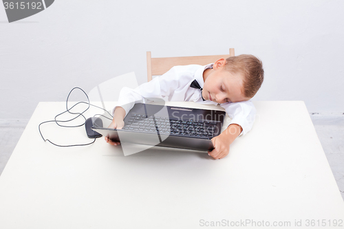 Image of Boy using his laptop computer