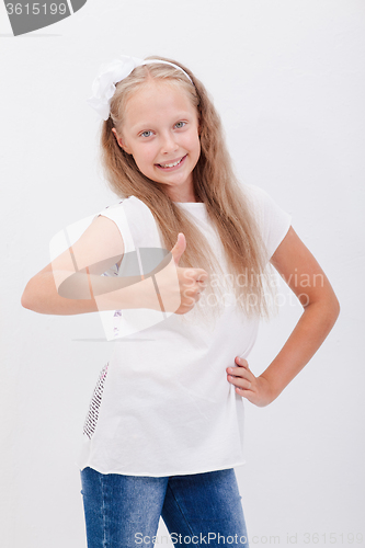 Image of Portrait of a beautiful girl showing thumbs up on white