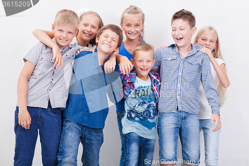 Image of The smiling teenagers on white 