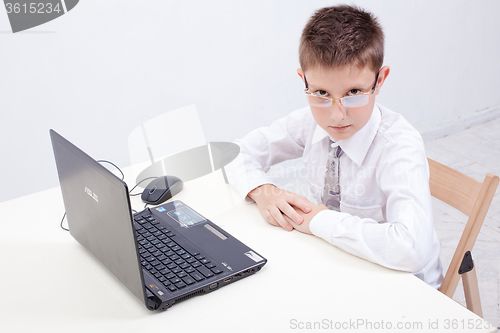 Image of Boy using his laptop computer