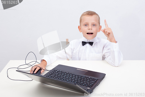 Image of Boy using his laptop computer