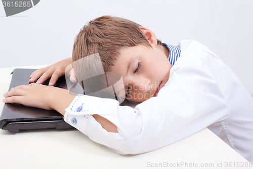 Image of Boy using his laptop computer