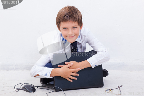 Image of Boy using his laptop computer