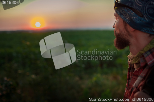Image of Young caucasian man against the sunset