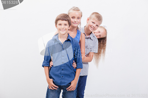 Image of The smiling teenagers on white 