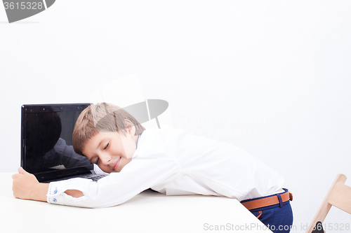 Image of Boy using his laptop computer