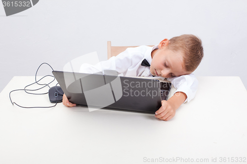 Image of Boy using his laptop computer