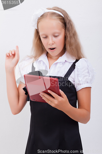 Image of Portrait of teen girl with calculator on white background