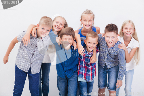 Image of The smiling teenagers on white 
