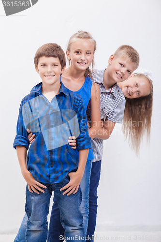 Image of The smiling teenagers on white 