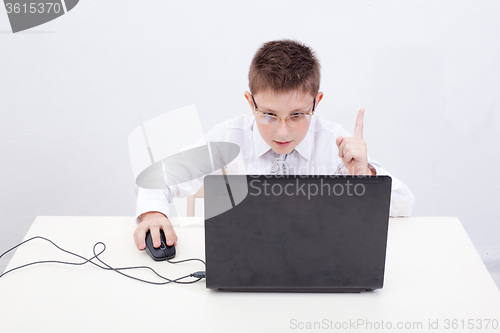 Image of Boy using his laptop computer