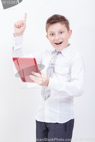 Image of Portrait of teen boy with calculator on white background