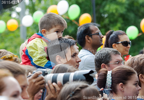 Image of Father and son watching a concert